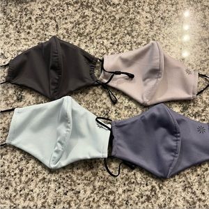 Athleta face masks in grey, blue, purple, and pink